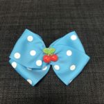 Smuk sløjfe i turkis med kirsebær